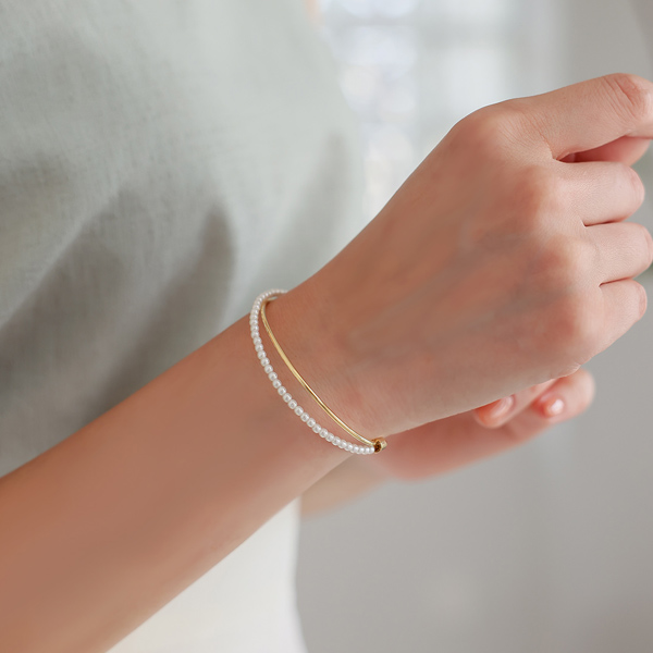 Pearl layered Gold Cross bracelet